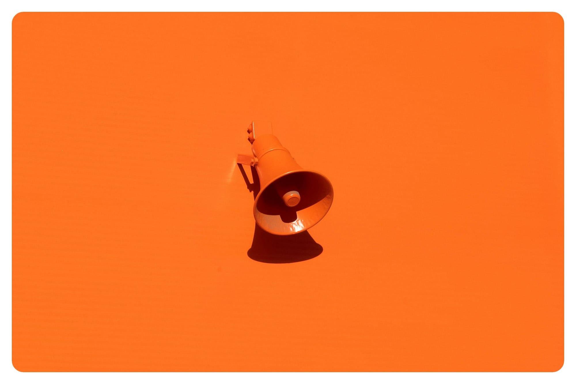orange megaphone on orange wall